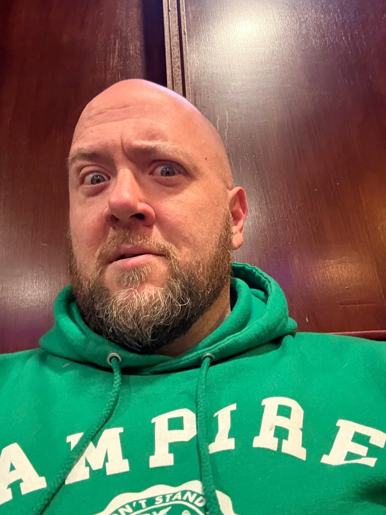 Heath looking decidedly doubtful in a green hoodie.